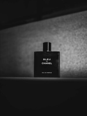 a bottle of perfume sitting on top of a table